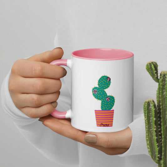 Color-inside ceramic mug with pink interior, white body, cactus graphic