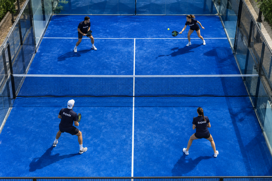 Individuals playing a game of padel