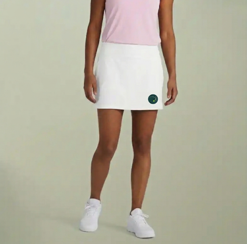 White sports skort with a straight hem and small logo on the front