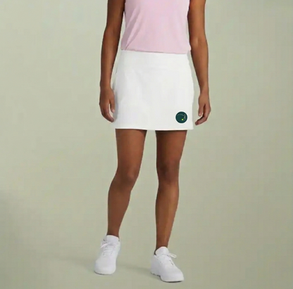 White sports skort with a straight hem and small logo on the front