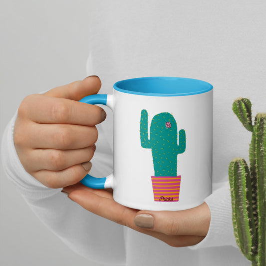 White ceramic mug with cactus print and blue interior
