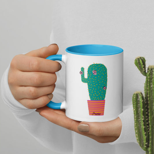 White ceramic mug with cactus graphic and blue interior rim