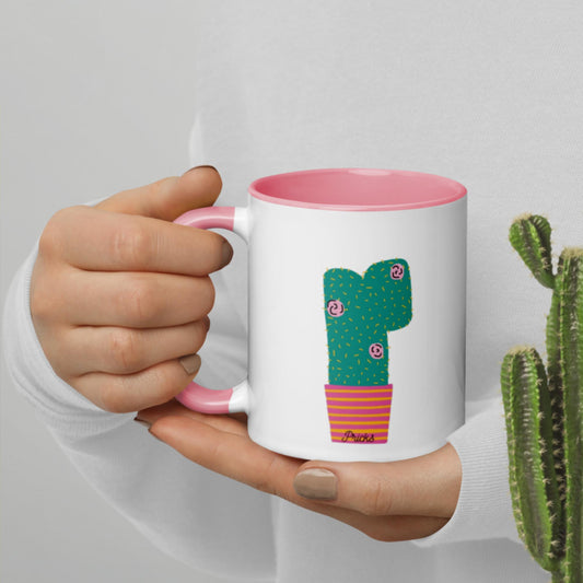 White ceramic mug with cactus graphic, pink interior, matching pink handle